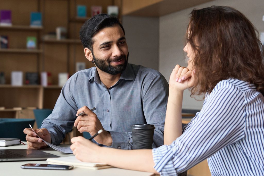 Two people have a conversation.