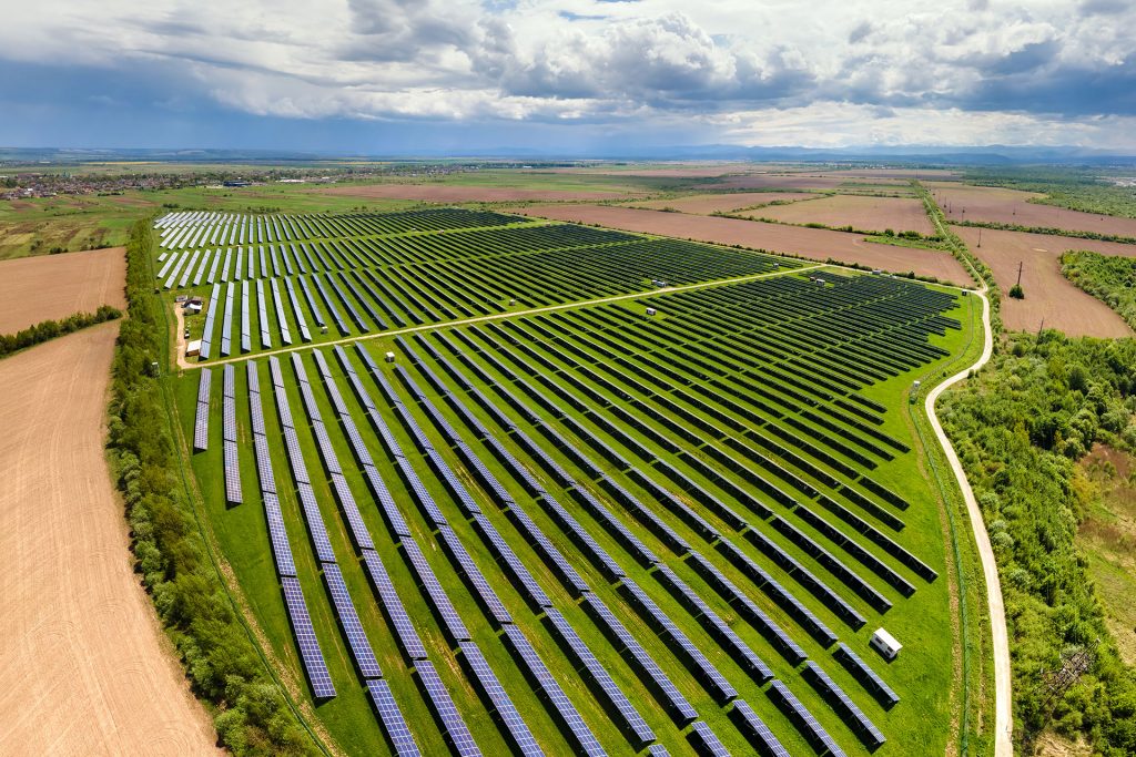 A field of solar panels in the sun.