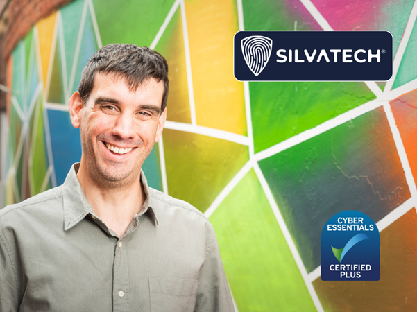 Silvatech managing director standing against a multi colour background