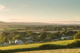 Picture of rolling countryside with houses and tree