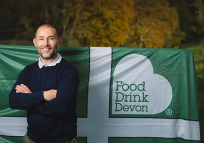 Picture of Greg Parsons with Food Drink Devon flag