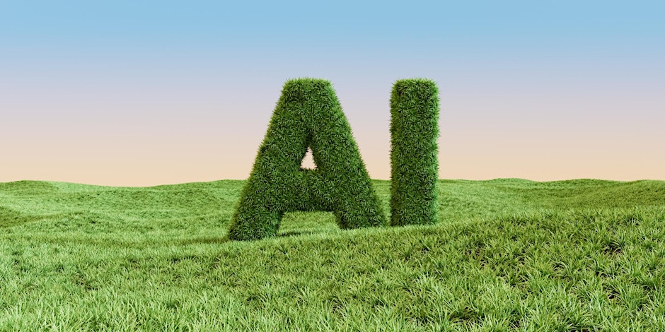 Picture of hedge in shape of AI on a grassy landscape