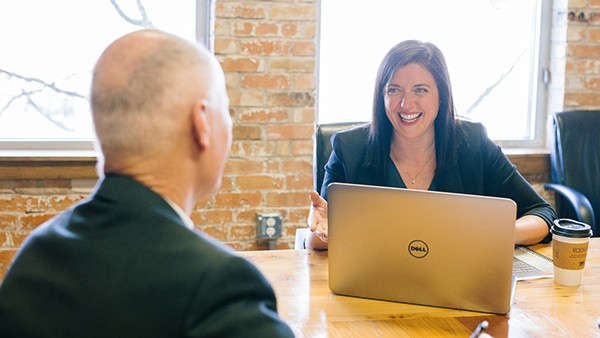 Photo of two people chatting for Somerset mentor programme